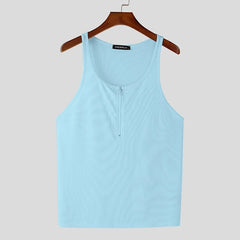 a flat lay of Blue Men’s Gym Glow Ribbed Zip Tank - pridevoyageshop.com - gay men's fashion, clubwear, party outfit

