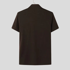 a flat lay of Brown Castro Catwalk Zip Tee - pridevoyageshop.com - gay men's fashion, clubwear, party outfit
