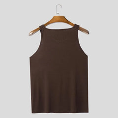 a flat lay of Brown Warehouse Code Harness Top - pridevoyageshop.com - gay men's harness, fetish gear, rave outfit
