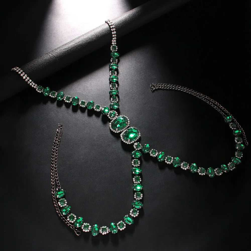 a flat lay of Gunmetal Emerald City Showgirl Gem Harness - pridevoyageshop.com - gay men's harness, fetish gear, rave outfit
