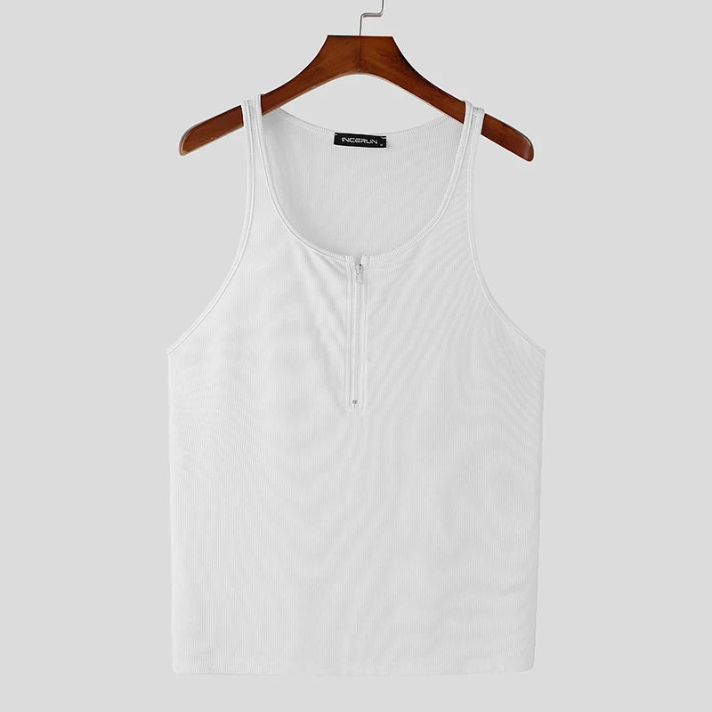 a flat lay of White Men’s Gym Glow Ribbed Zip Tank - pridevoyageshop.com - gay men's fashion, clubwear, party outfit
