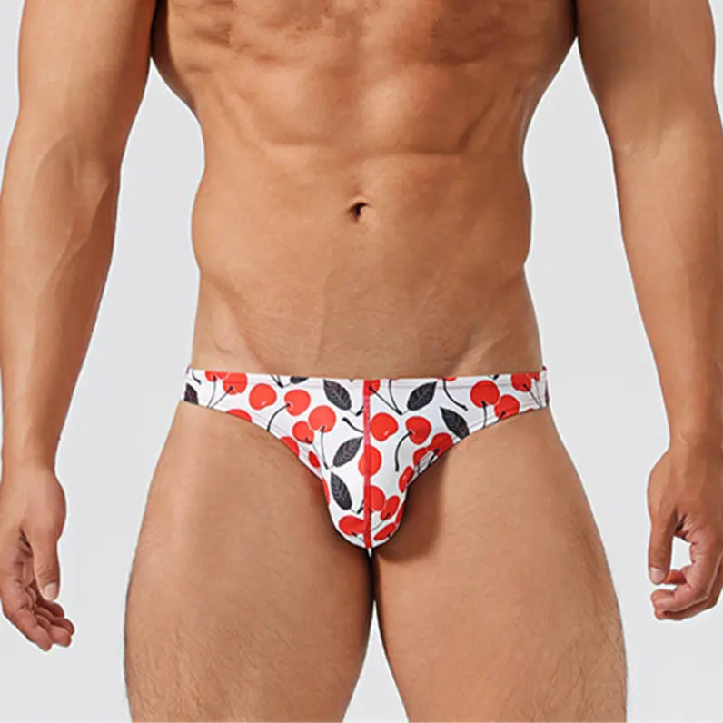 a hot man in Men’s Cherry Poppin’ Swim Briefs - pridevoyageshop.com - gay men’s sexy swim briefs, trunks, board shorts, and bikinis