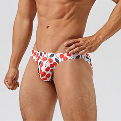 a hot man in Men’s Cherry Poppin’ Swim Briefs - pridevoyageshop.com - gay men’s sexy swim briefs, trunks, board shorts, and bikinis