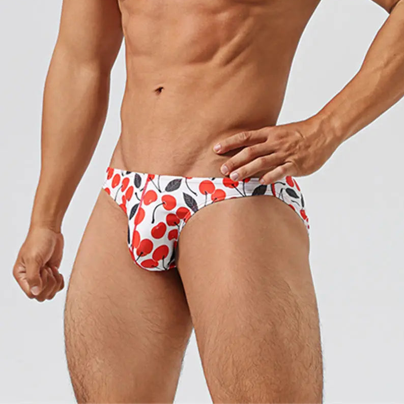a hot man in Men’s Cherry Poppin’ Swim Briefs - pridevoyageshop.com - gay men’s sexy swim briefs, trunks, board shorts, and bikinis