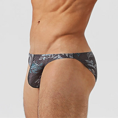 a sexy man inMen’s Midnight Jungle Jock Bikini Swim Briefs - pridevoyageshop.com - gay men’s sexy swim briefs, trunks, board shorts, and bikinis