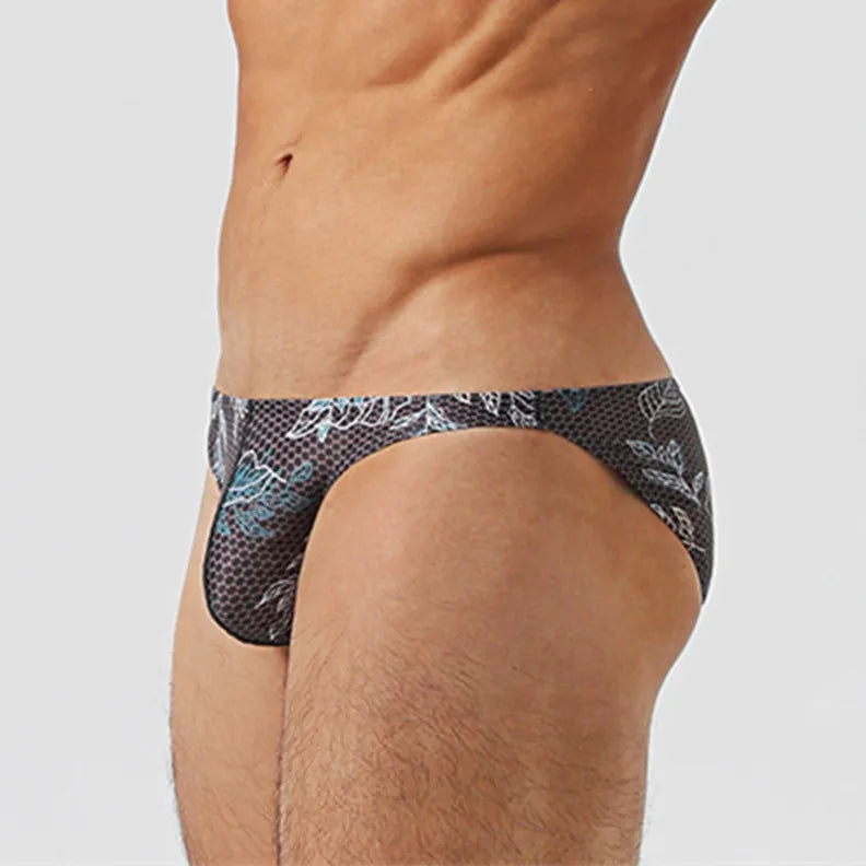 a sexy man inMen’s Midnight Jungle Jock Bikini Swim Briefs - pridevoyageshop.com - gay men’s sexy swim briefs, trunks, board shorts, and bikinis