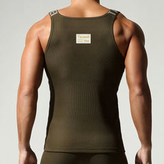 a sexy man in Army Green Muscle Mary Ribbed Strap Top - pridevoyageshop.com - gay men's fashion, clubwear, party outfit

