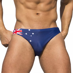 a sexy man in Australia Flag flag Men’s World Tour Bikini Swim Briefs - pridevoyageshop.com - gay men’s sexy swim briefs, trunks, board shorts, and bikinis