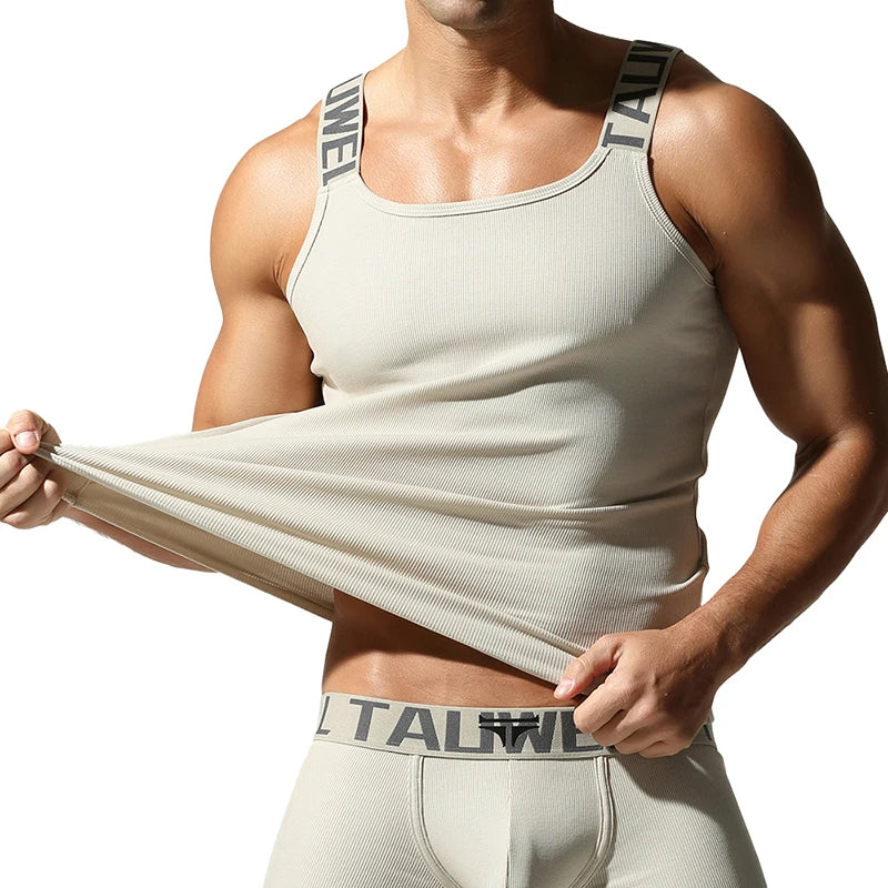 a sexy man in Beige White Muscle Mary Ribbed Strap Top - pridevoyageshop.com - gay men's fashion, clubwear, party outfit

