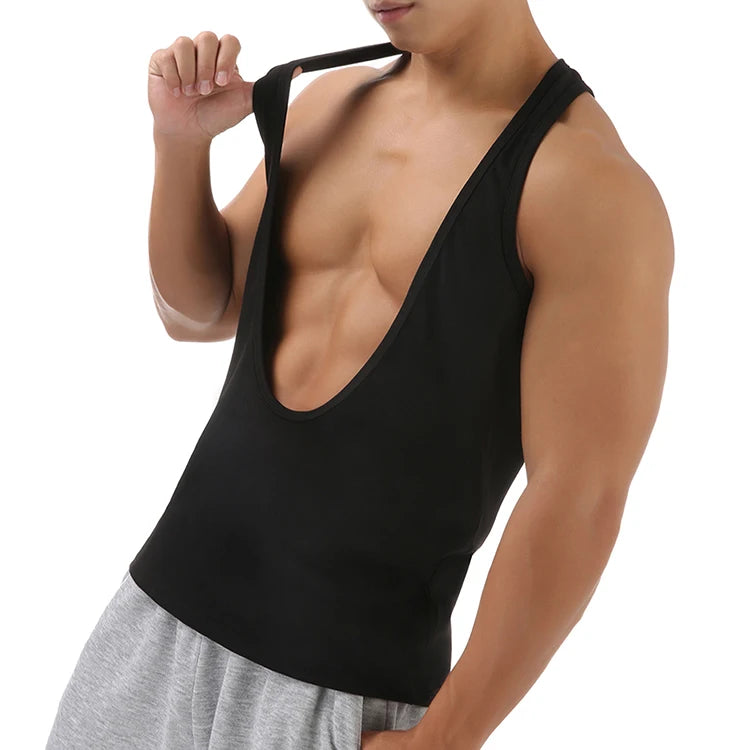 a sexy man in Black Discipline Plunge Tank - pridevoyageshop.com - gay men's fashion, clubwear, party outfit
