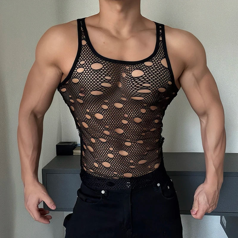 a sexy man in Black Go-Go Holey Cut-Out Mesh Top - pridevoyageshop.com - gay men's fashion, clubwear, party outfit
