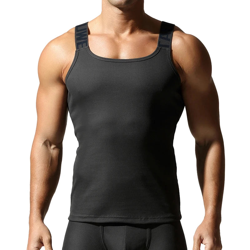 a sexy man in Black Gray Muscle Mary Ribbed Strap Top - pridevoyageshop.com - gay men's fashion, clubwear, party outfit
