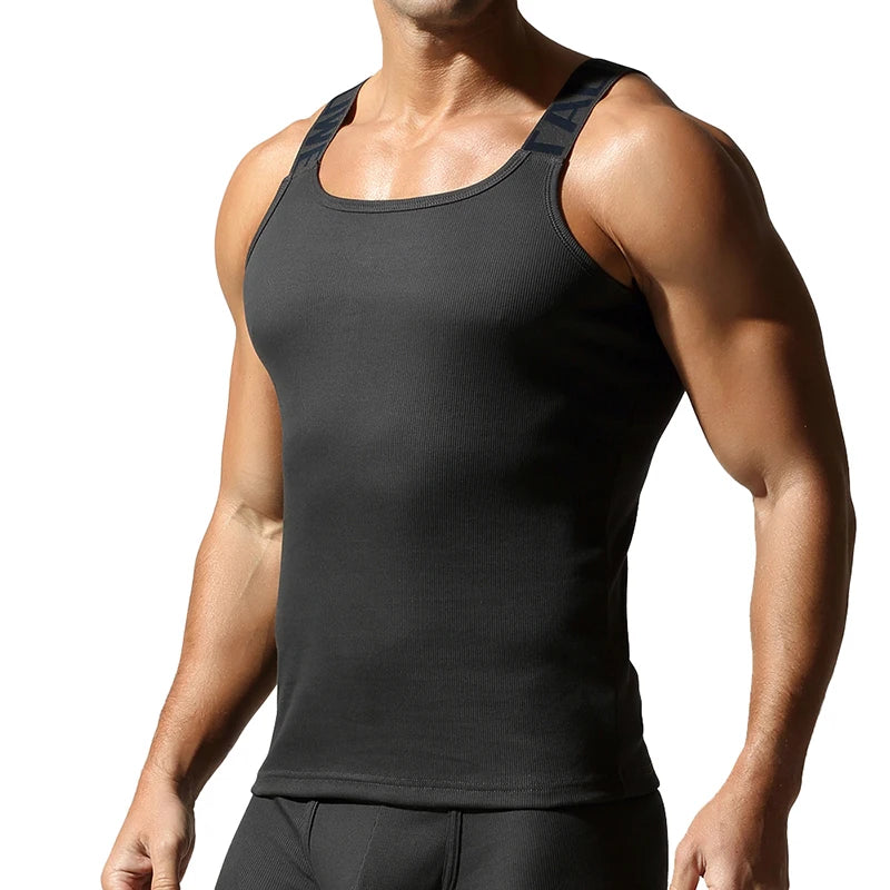 a sexy man in Black Gray Muscle Mary Ribbed Strap Top - pridevoyageshop.com - gay men's fashion, clubwear, party outfit
