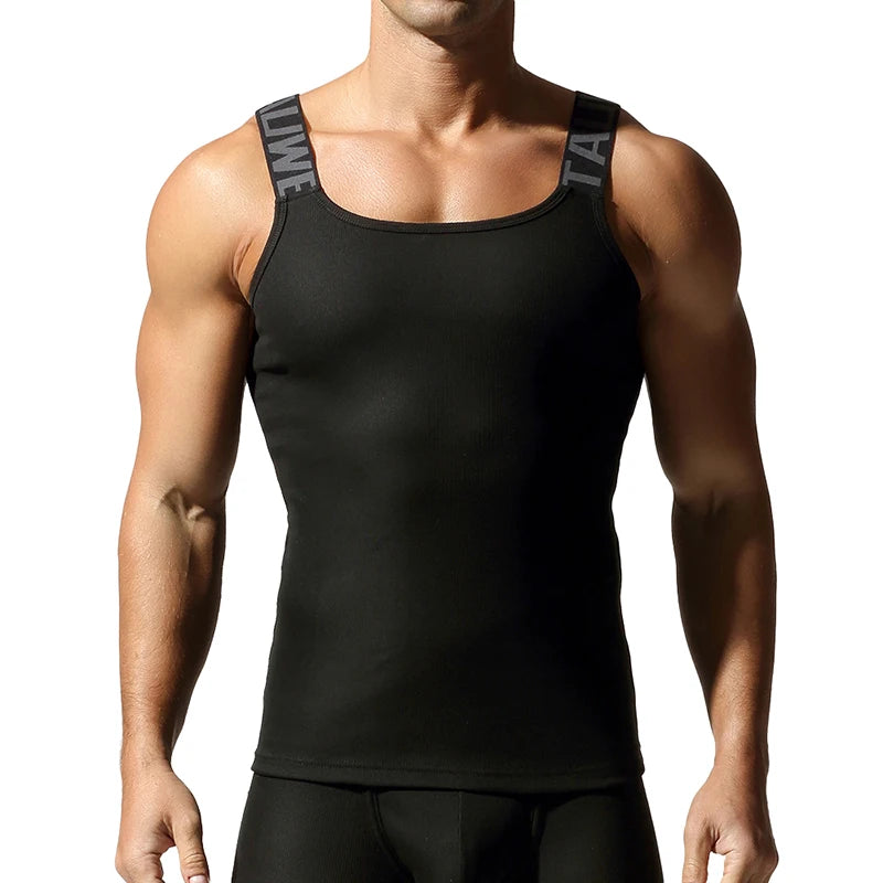 a sexy man in Black Muscle Mary Ribbed Strap Top - pridevoyageshop.com - gay men's fashion, clubwear, party outfit
