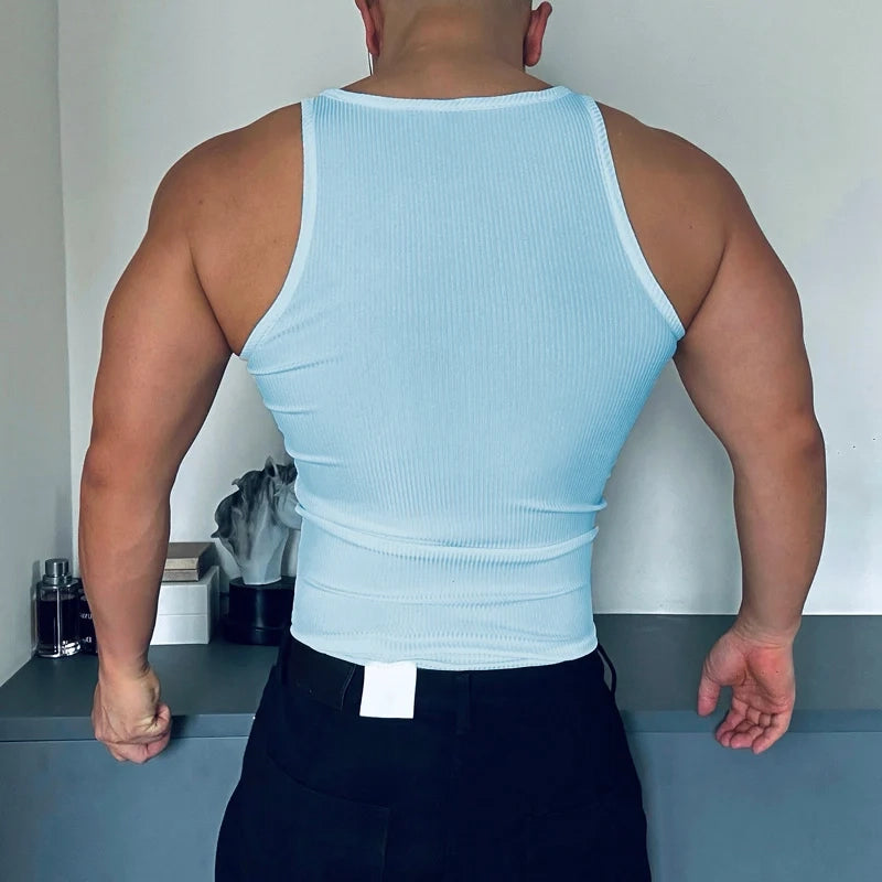 a sexy man in Blue Men’s Gym Glow Ribbed Zip Tank - pridevoyageshop.com - gay men's fashion, clubwear, party outfit
