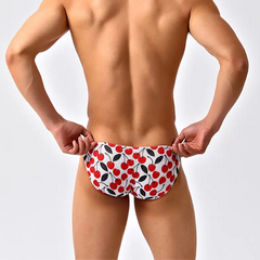 a sexy man in Cherry Tease Men’s Red Light Marina Mesh Bikini Swim Briefs - pridevoyageshop.com - gay men’s sexy swim briefs, trunks, board shorts, and bikinis