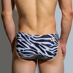 a sexy man in Classic Zebra Men’s Savage Safari Swim Briefs - pridevoyageshop.com - gay men’s sexy swim briefs, trunks, board shorts, and bikinis