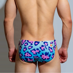 a sexy man in DM Men’s Cattitude Swim Briefs - pridevoyageshop.com - gay men’s sexy swim briefs, trunks, board shorts, and bikinis
