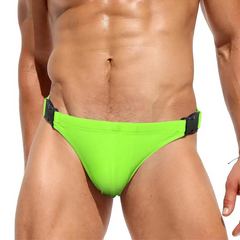 a sexy man in Fluorescent Green Men’s Unclip Me Double Buckle Swim Briefs - pridevoyageshop.com - gay men’s sexy swim briefs, trunks, board shorts, and bikinis