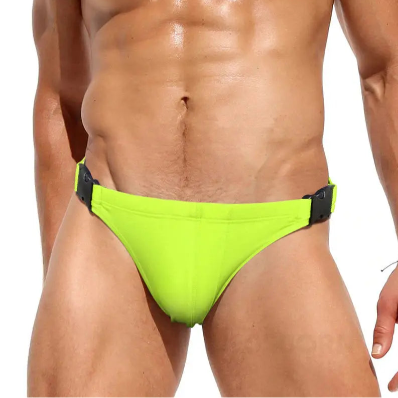 a sexy man in Fluorescent yellow Men’s Unclip Me Double Buckle Swim Briefs - pridevoyageshop.com - gay men’s sexy swim briefs, trunks, board shorts, and bikinis