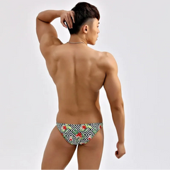a sexy man in Geometric Floral Men’s Summer Bloom Swim Bikini Briefs - pridevoyageshop.com - gay men’s sexy swim briefs, trunks, board shorts, and bikinis