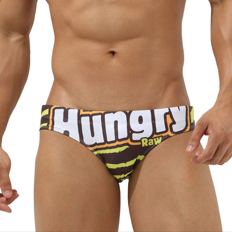 a sexy man in Hungry Raw Men’s Candy Crushin’ Swim Briefs - pridevoyageshop.com - gay men’s sexy swim briefs, trunks, board shorts, and bikinis
