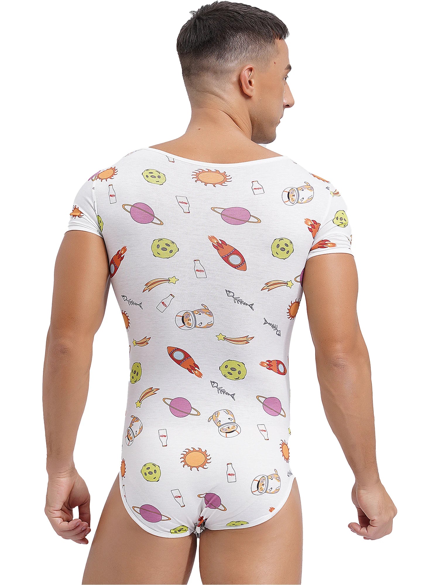 a sexy man in Intergalactic Yum Daddy’s Boy Printed Onesie, outer-space cute print, tight fit, cosmic baby boy fantasy – pridevoyageshop.com – gay men’s harness, lingerie and fetish wear