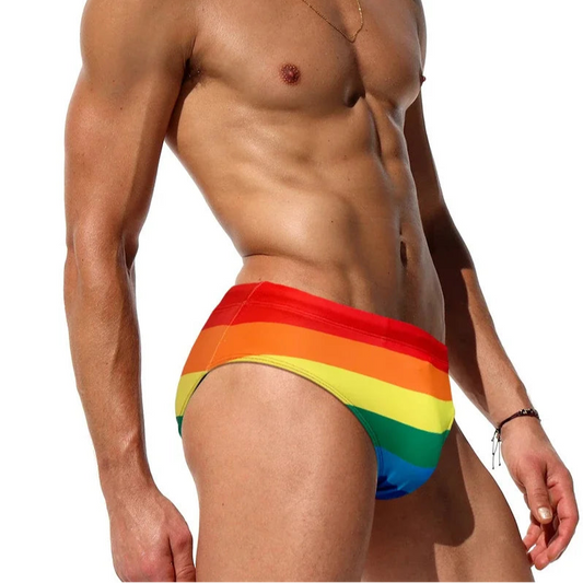 a sexy man in Men's Bottom of the Rainbow Swim Briefs - pridevoyageshop.com - gay men’s sexy swim briefs, trunks, board shorts, and bikinis