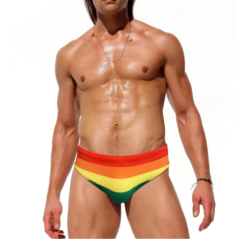a sexy man in Men's Bottom of the Rainbow Swim Briefs - pridevoyageshop.com - gay men’s sexy swim briefs, trunks, board shorts, and bikinis