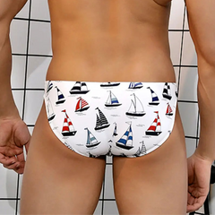 a sexy man in Men’s Cabin Boy Swim Briefs - pridevoyageshop.com - gay men’s sexy swim briefs, trunks, board shorts, and bikinis