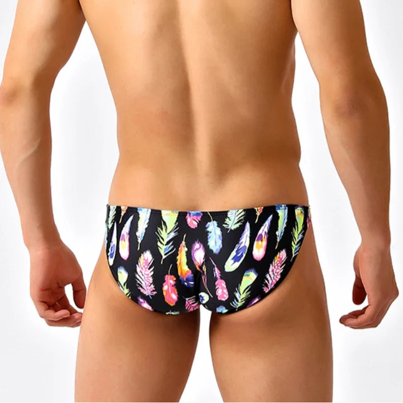 a sexy man in Men’s Colorful Feather Skinny Swim Briefs - pridevoyageshop.com - gay men’s sexy swim briefs, trunks, board shorts, and bikinis