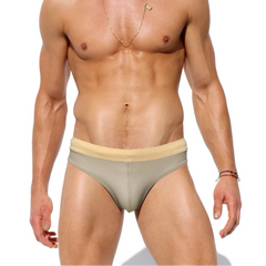 a sexy man in Men’s Creamy Dream Nude Swim Briefs - pridevoyageshop.com - gay men’s sexy swim briefs, trunks, board shorts, and bikinis