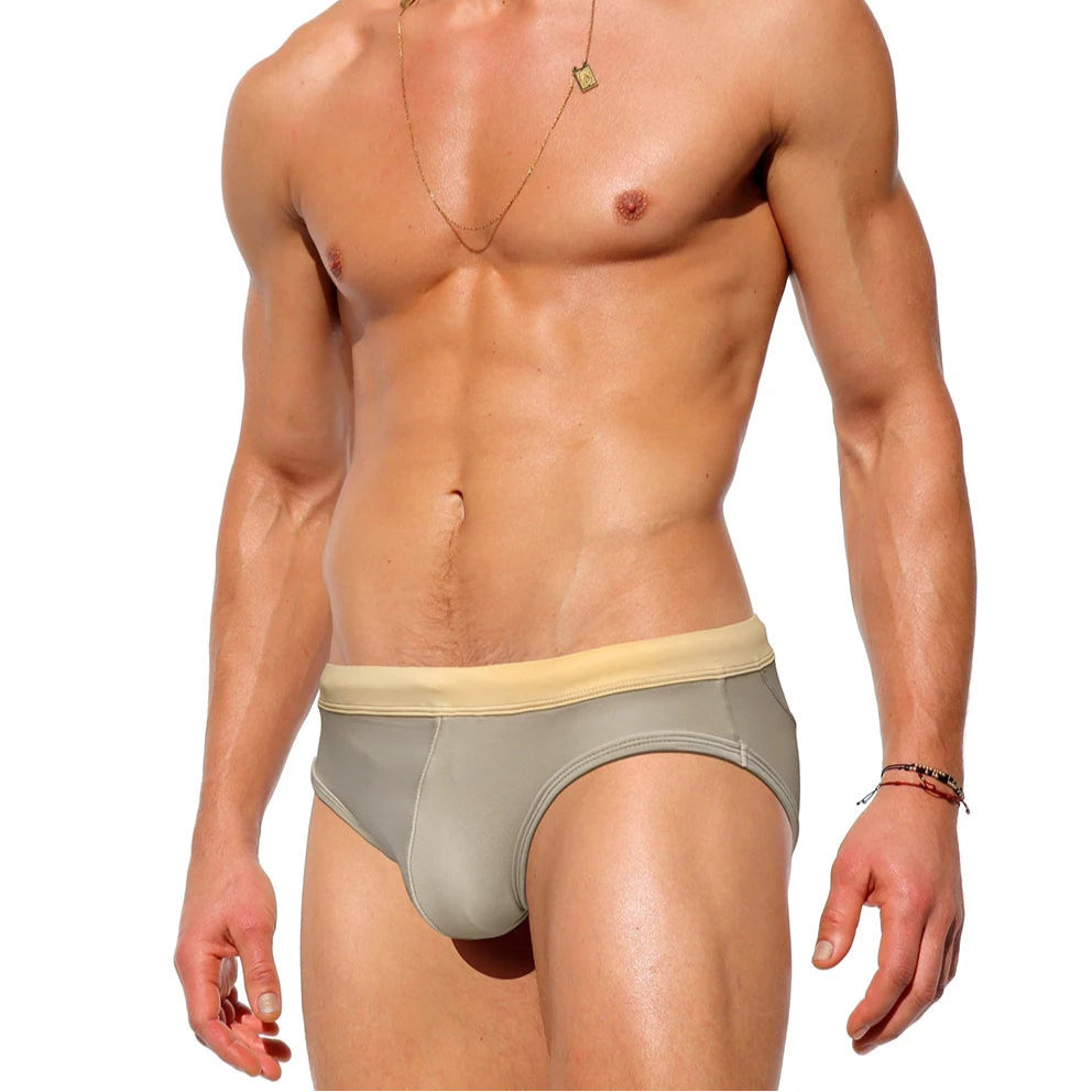 a sexy man in Men’s Creamy Dream Nude Swim Briefs - pridevoyageshop.com - gay men’s sexy swim briefs, trunks, board shorts, and bikinis