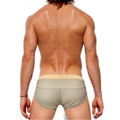 a sexy man in Men’s Creamy Dream Nude Swim Briefs - pridevoyageshop.com - gay men’s sexy swim briefs, trunks, board shorts, and bikinis