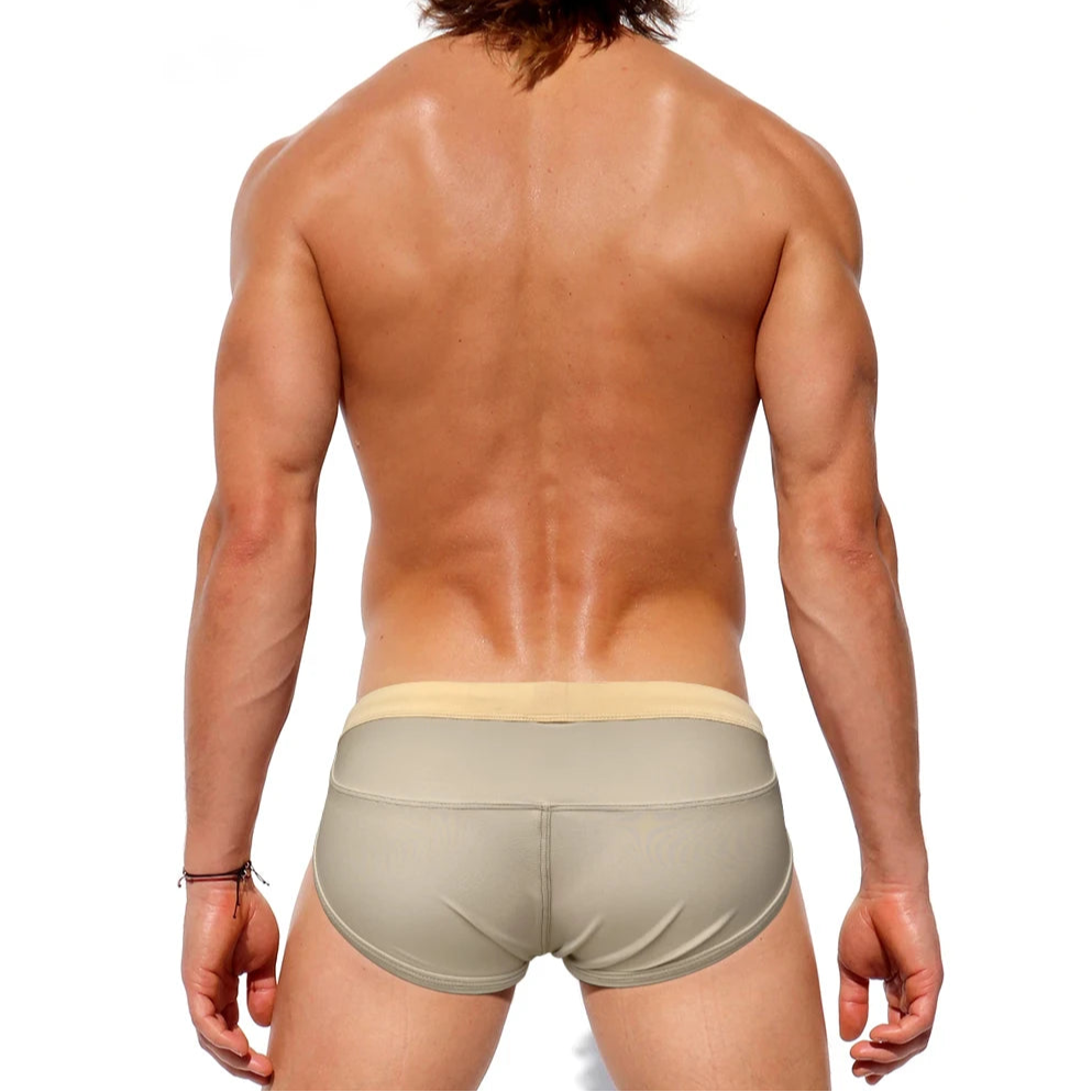a sexy man in Men’s Creamy Dream Nude Swim Briefs - pridevoyageshop.com - gay men’s sexy swim briefs, trunks, board shorts, and bikinis