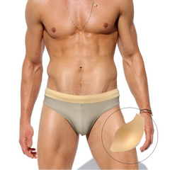 a sexy man in Men’s Creamy Dream Nude Swim Briefs with pad - pridevoyageshop.com - gay men’s sexy swim briefs, trunks, board shorts, and bikinis