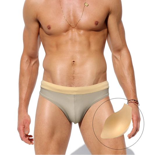a sexy man in Men’s Creamy Dream Nude Swim Briefs with pad - pridevoyageshop.com - gay men’s sexy swim briefs, trunks, board shorts, and bikinis