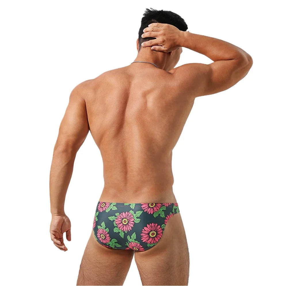 a sexy man in Men’s Daisy Dare Swim Bikini Briefs - pridevoyageshop.com - gay men’s sexy swim briefs, trunks, board shorts, and bikinis
