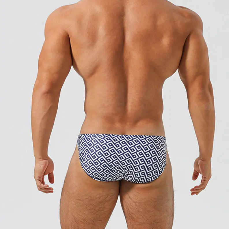 a sexy man in Men’s Greek Key Swim Briefs - pridevoyageshop.com - gay men’s sexy swim briefs, trunks, board shorts, and bikinis