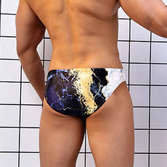a sexy man in Men’s Hard Marble Swim Briefs - pridevoyageshop.com - gay men’s sexy swim briefs, trunks, board shorts, and bikinis