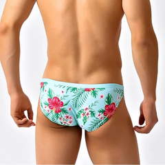 a sexy man in Men’s Hibiscus Beauty Bikini Swim Briefs - pridevoyageshop.com - gay men’s sexy swim briefs, trunks, board shorts, and bikinis