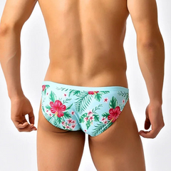 a sexy man in Men’s Hibiscus Beauty Bikini Swim Briefs - pridevoyageshop.com - gay men’s sexy swim briefs, trunks, board shorts, and bikinis