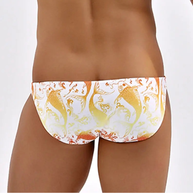 a sexy man in Men’s Koi Me Harder Bikini Swim Briefs - pridevoyageshop.com - gay men’s sexy swim briefs, trunks, board shorts, and bikinis