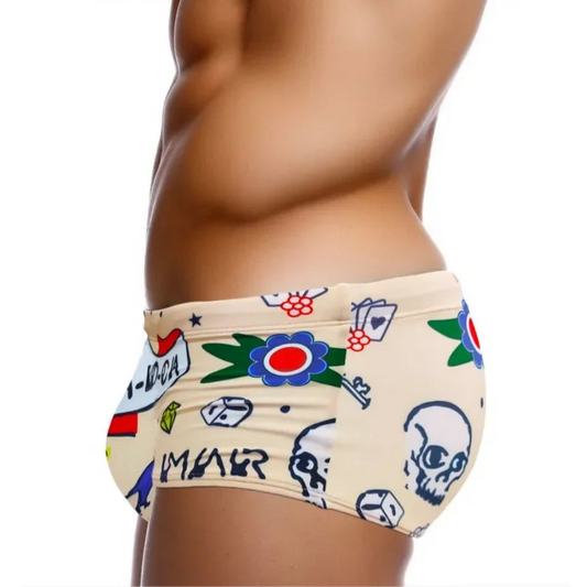a sexy man in Men’s Lust & Luck Low Rise Swim Trunks - pridevoyageshop.com - gay men’s sexy swim briefs, trunks, board shorts, and bikinis