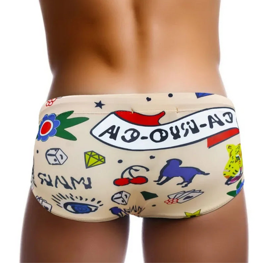 a sexy man in Men’s Lust & Luck Low Rise Swim Trunks - pridevoyageshop.com - gay men’s sexy swim briefs, trunks, board shorts, and bikinis