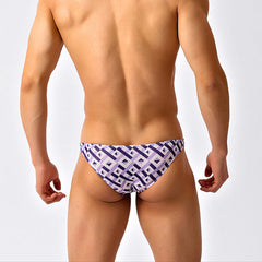 a sexy man in Men’s Mesh Matrix Bikini Swim Briefs - pridevoyageshop.com - gay men’s sexy swim briefs, trunks, board shorts, and bikinis