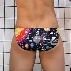 a sexy man in Men’s Orbit My Booty Space Bikini Swim Briefs - pridevoyageshop.com - gay men’s sexy swim briefs, trunks, board shorts, and bikinis