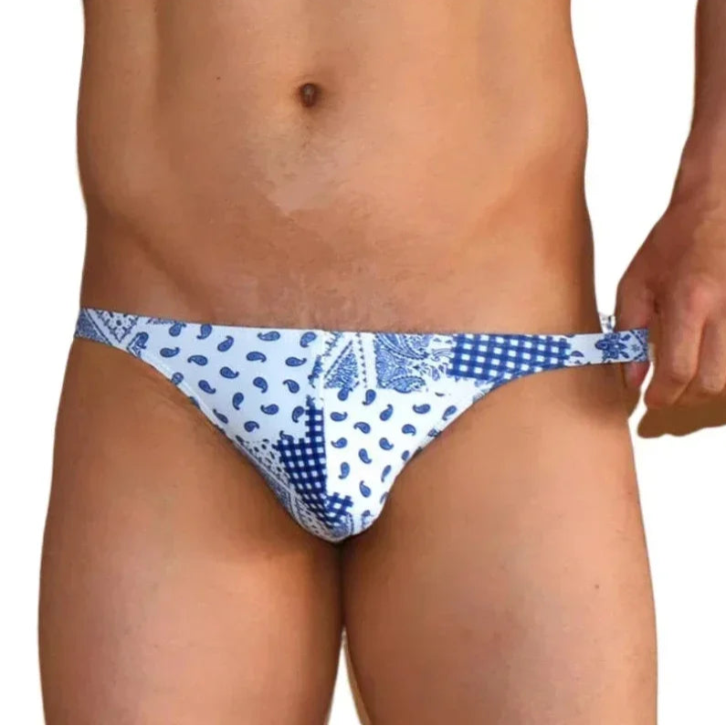 a sexy man in Men’s Patch Me Up Micro Bikini Swim Briefs - pridevoyageshop.com - gay men’s sexy swim briefs, trunks, board shorts, and bikinis