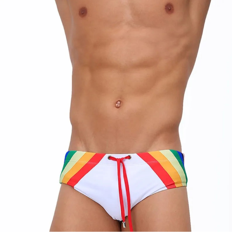 a sexy man in Men’s Pride Passion Swim Brief with Pad - pridevoyageshop.com - gay men’s sexy swim briefs, trunks, board shorts, and bikinis