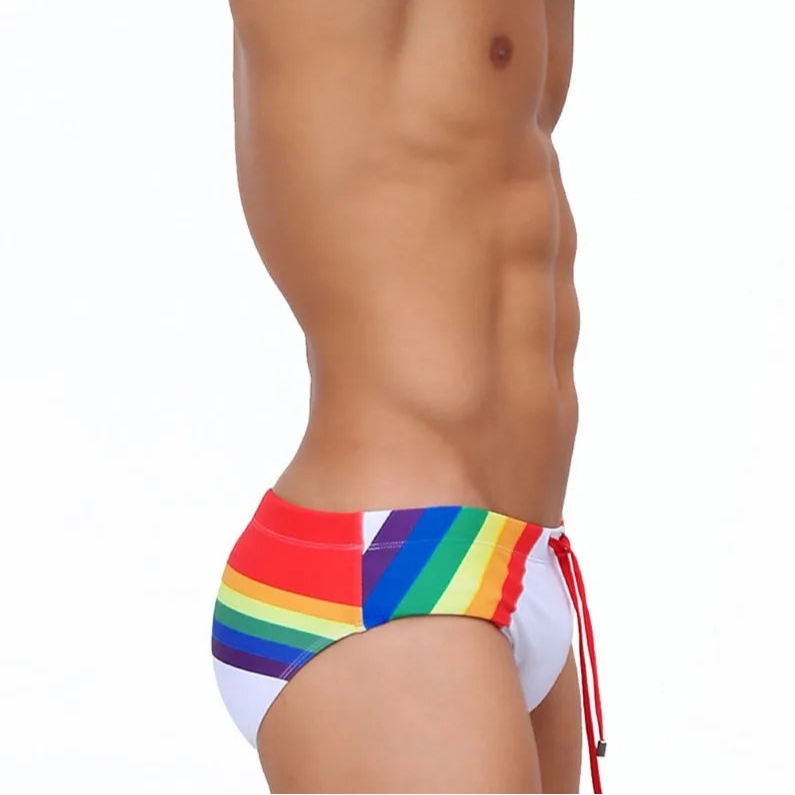 a sexy man in Men’s Pride Passion Swim Brief with Pad - pridevoyageshop.com - gay men’s sexy swim briefs, trunks, board shorts, and bikinis